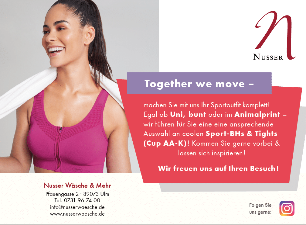 A woman wearing a pink sports bra and holding a towel. Beschreibung von KI generiert